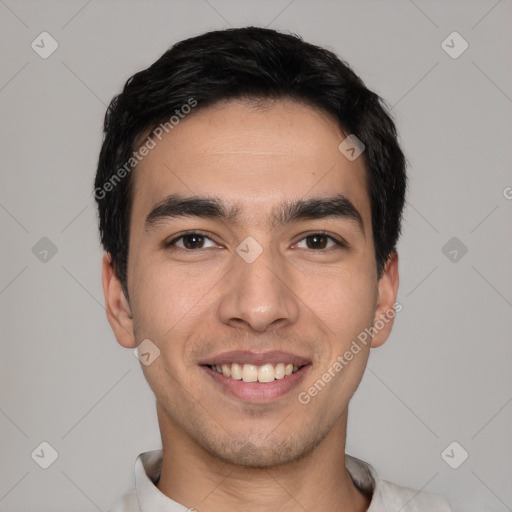 Joyful white young-adult male with short  black hair and brown eyes