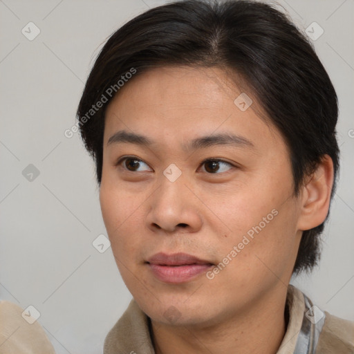 Joyful asian young-adult male with short  brown hair and brown eyes