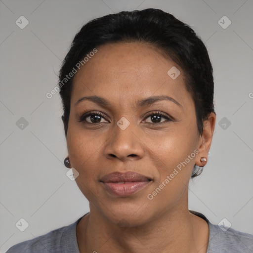 Joyful black adult female with short  black hair and brown eyes