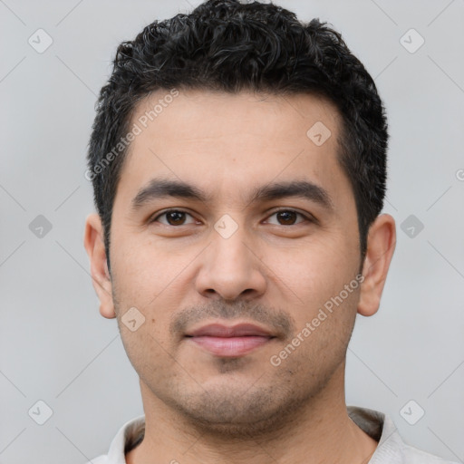 Joyful white young-adult male with short  black hair and brown eyes