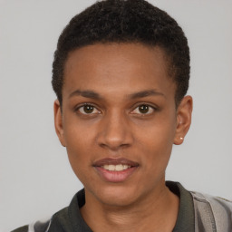 Joyful black young-adult male with short  brown hair and brown eyes