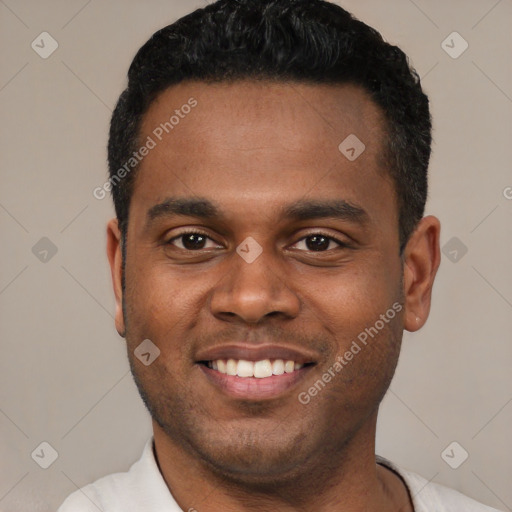 Joyful latino young-adult male with short  black hair and brown eyes