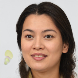 Joyful asian young-adult female with medium  brown hair and brown eyes