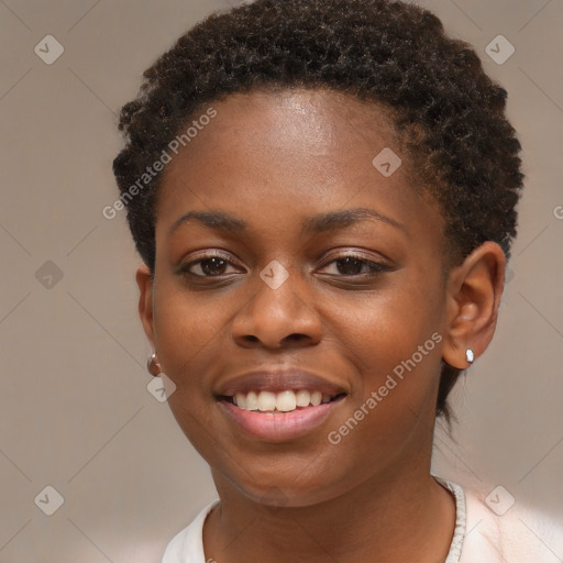 Joyful black young-adult female with short  brown hair and brown eyes