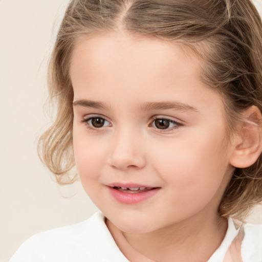 Joyful white child female with medium  brown hair and brown eyes