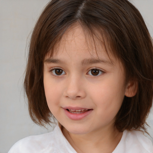 Joyful white child female with medium  brown hair and brown eyes