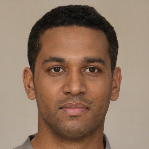 Neutral black young-adult male with short  brown hair and brown eyes