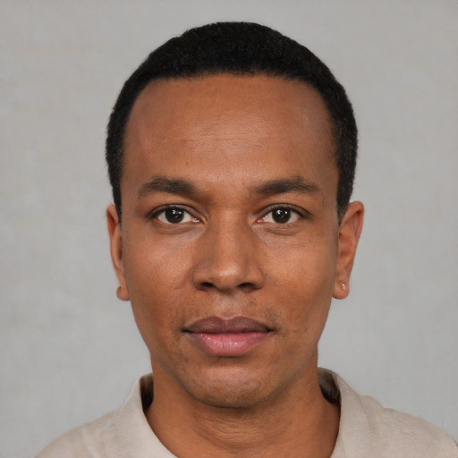 Neutral black young-adult male with short  black hair and brown eyes