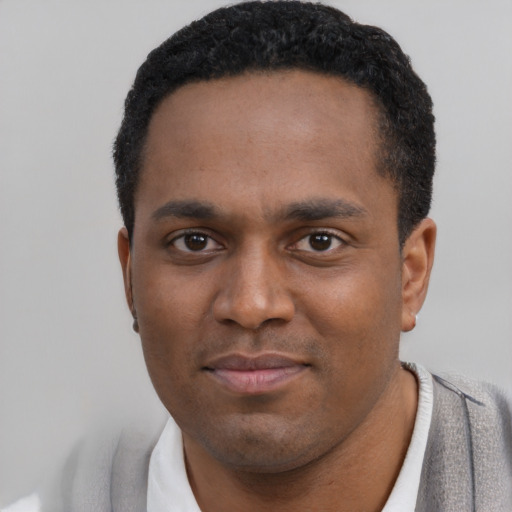 Neutral black young-adult male with short  black hair and brown eyes