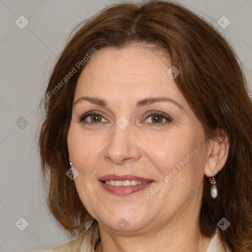 Joyful white adult female with medium  brown hair and brown eyes