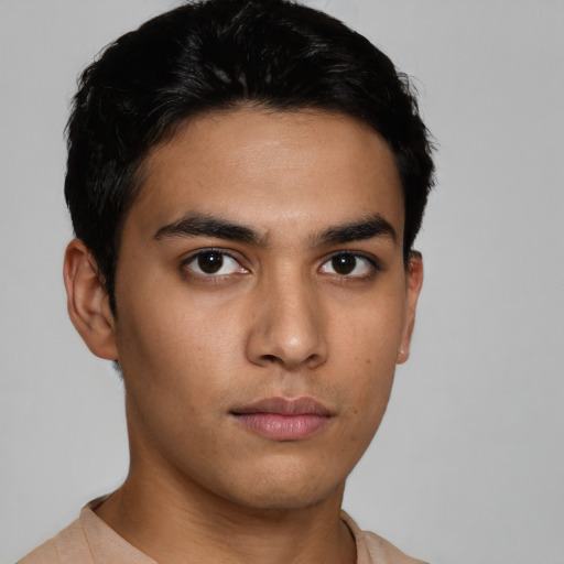 Neutral latino young-adult male with short  brown hair and brown eyes