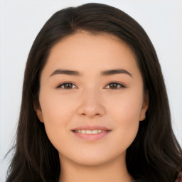 Joyful asian young-adult female with long  brown hair and brown eyes