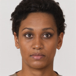 Neutral black young-adult female with short  brown hair and brown eyes