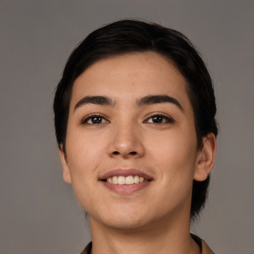 Joyful white young-adult female with short  black hair and brown eyes