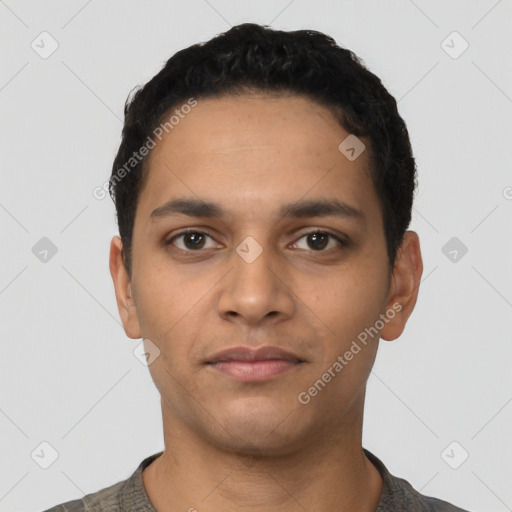 Neutral latino young-adult male with short  black hair and brown eyes