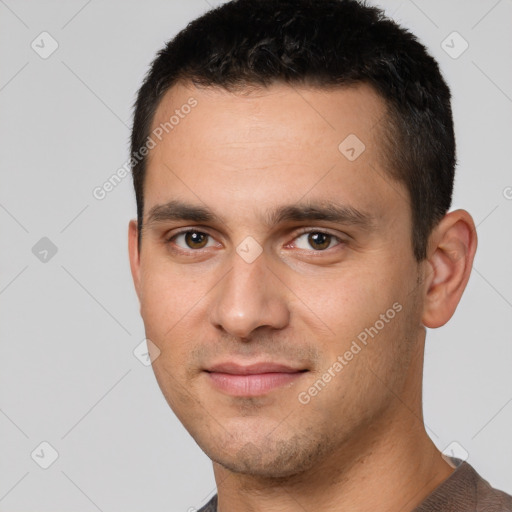 Joyful white young-adult male with short  black hair and brown eyes