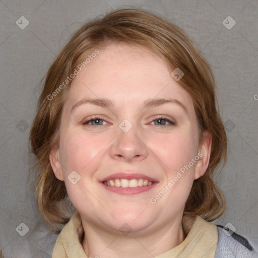 Joyful white young-adult female with medium  brown hair and blue eyes