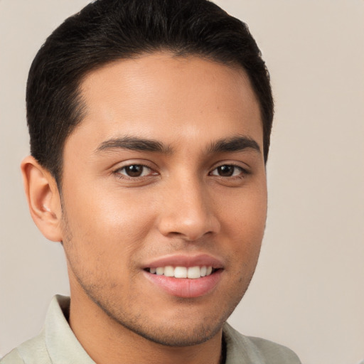 Joyful white young-adult male with short  brown hair and brown eyes