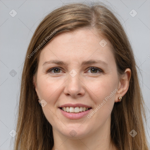 Joyful white young-adult female with long  brown hair and grey eyes