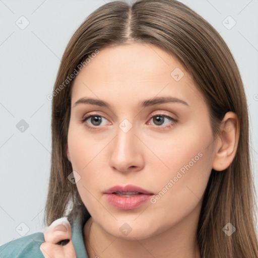 Neutral white young-adult female with long  brown hair and brown eyes