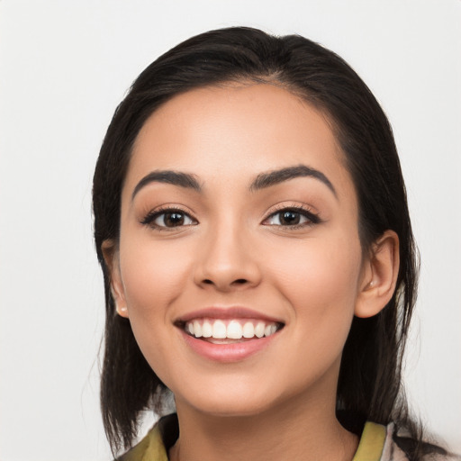 Joyful white young-adult female with medium  black hair and brown eyes