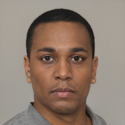 Neutral black young-adult male with short  black hair and brown eyes