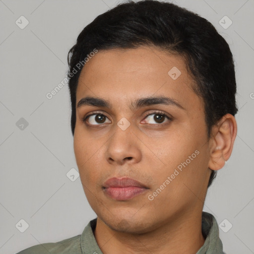 Neutral latino young-adult male with short  black hair and brown eyes