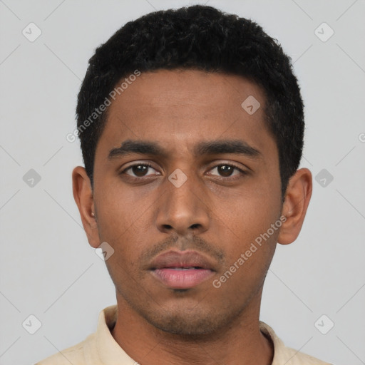Neutral latino young-adult male with short  black hair and brown eyes