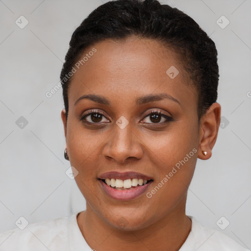 Joyful black young-adult female with short  brown hair and brown eyes