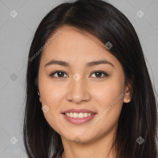 Joyful asian young-adult female with long  brown hair and brown eyes