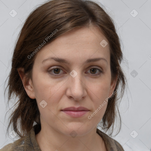 Joyful white adult female with medium  brown hair and grey eyes