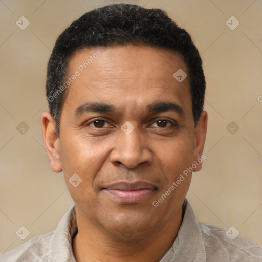 Joyful latino adult male with short  black hair and brown eyes