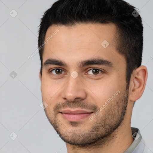 Joyful white young-adult male with short  brown hair and brown eyes