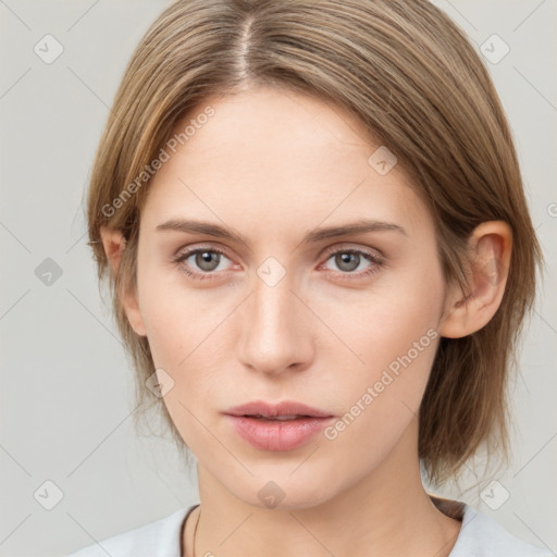 Neutral white young-adult female with medium  brown hair and grey eyes