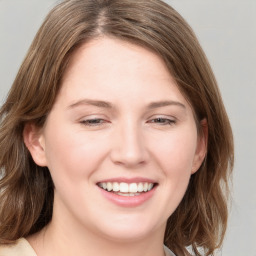 Joyful white young-adult female with medium  brown hair and blue eyes