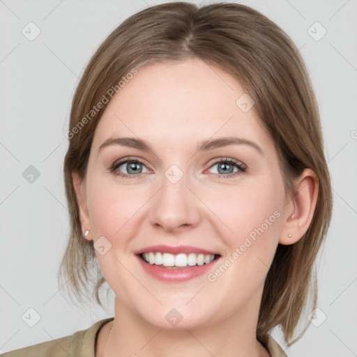 Joyful white young-adult female with medium  brown hair and blue eyes