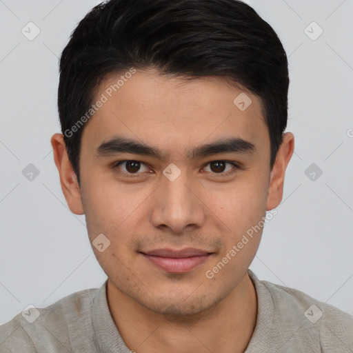 Joyful asian young-adult male with short  black hair and brown eyes