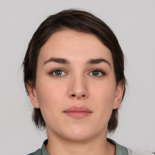 Neutral white young-adult female with medium  brown hair and brown eyes