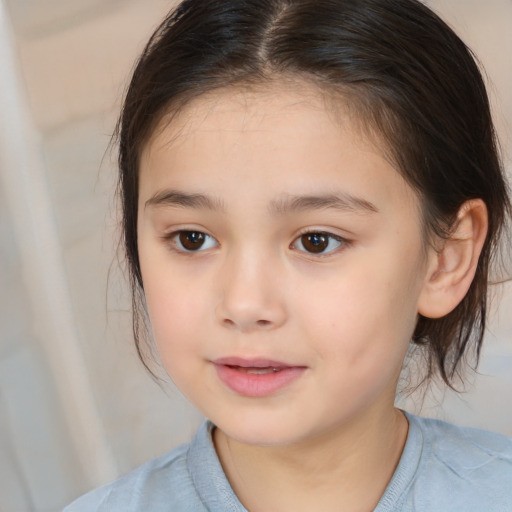 Joyful white child female with medium  brown hair and brown eyes