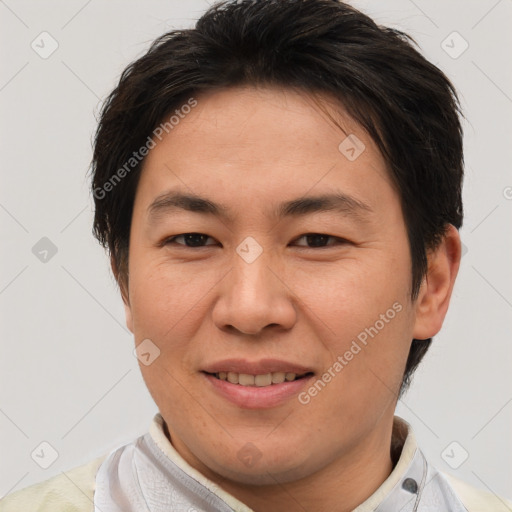 Joyful asian young-adult male with short  brown hair and brown eyes