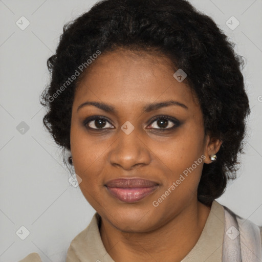 Joyful black young-adult female with long  black hair and brown eyes