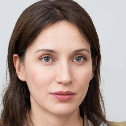 Neutral white young-adult female with long  brown hair and grey eyes