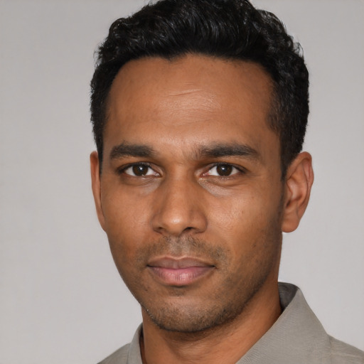 Neutral latino young-adult male with short  black hair and brown eyes