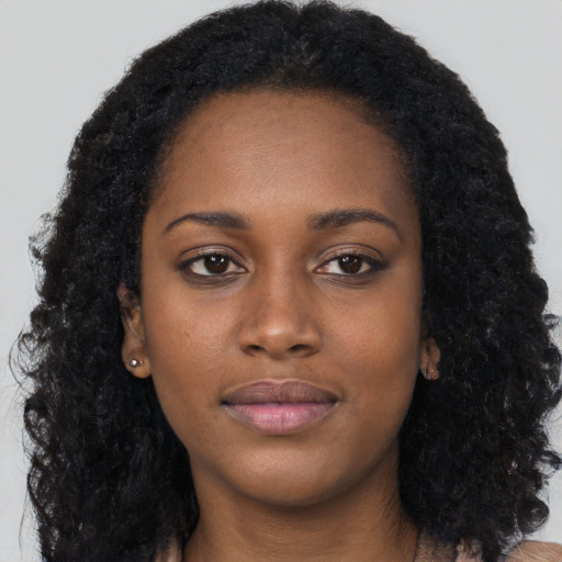 Neutral black young-adult female with long  black hair and brown eyes