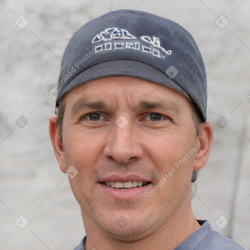 Joyful white adult male with short  brown hair and grey eyes