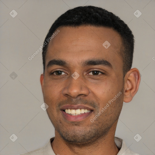 Joyful black young-adult male with short  black hair and brown eyes