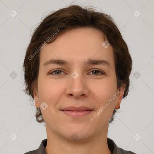 Joyful white young-adult female with short  brown hair and grey eyes