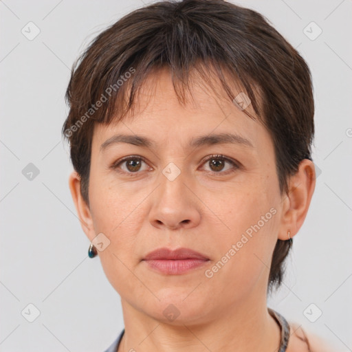 Joyful white adult female with short  brown hair and brown eyes