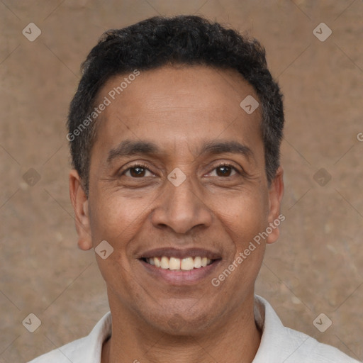 Joyful latino adult male with short  black hair and brown eyes