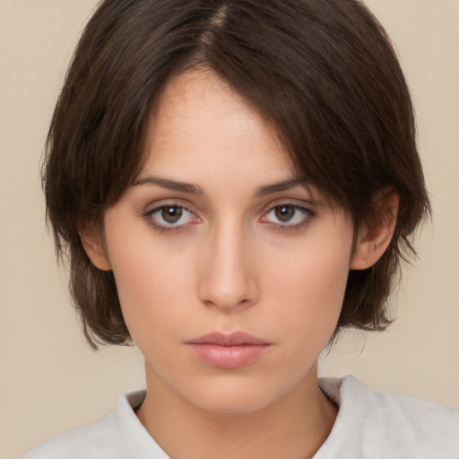 Neutral white young-adult female with medium  brown hair and brown eyes